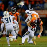 Tight end Matt LaCosse #83 of the Denver Broncos is upended by defensive back Desmond King #20 of the Los Angeles Chargers in the fourth quarter of a game at Broncos Stadium at Mile High on December 30, 2018 in Denver, Colorado. (Photo by Justin Edmonds/Getty Images)