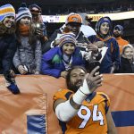 Domata Peko (94) of the Denver Broncos takes a selfie with fans after losing to the Los Angeles Chargers. The Denver Broncos lost to the Los Angeles Chargers 23-9 at Broncos Stadium at Mile High in Denver, Colorado on Sunday, December 30, 2018. The Broncos' final season record is 6-10. (Photo by Andy Cross/The Denver Post via Getty Images)
