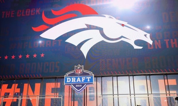 The Denver Broncos logo is seen on a video board during the first round of the 2018 NFL Draft at AT...
