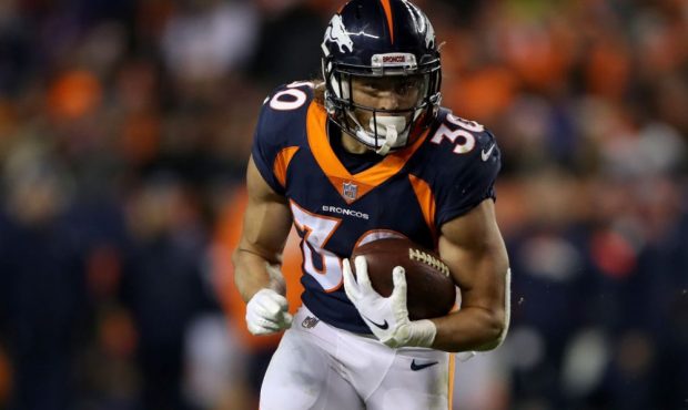 Phillip Lindsay #30 of the Denver Broncos carries the ball against the Cleveland Browns at Broncos ...