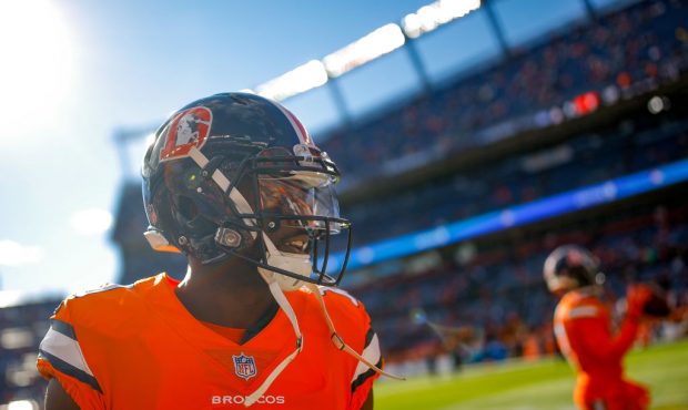 Wide receiver Emmanuel Sanders #10 of the Denver Broncos stands on the field as players warm up bef...