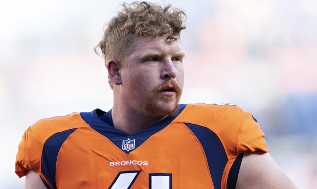 Matt Paradis #61 of the Denver Broncos warming up before a game against the Minnesota Vikings durin...