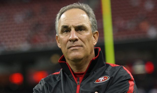 Defensive Coordinator Vic Fangio of the San Francisco 49ers stands on the field prior to the game a...