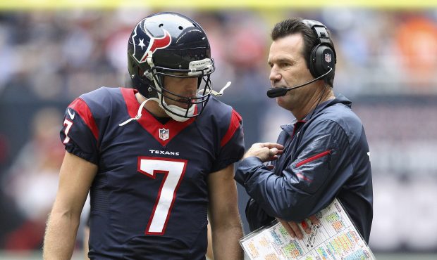 Case Keenum #7 of the Houston Texans talks with coach Gary Kubiak during the game against the New E...