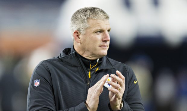 Offensive Line Coach Mike Munchak of the Pittsburgh Steelers watching the team warm up before a gam...