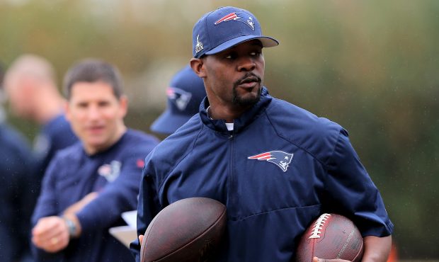 Safeties coach Brian Flores gets the balls ready for drills during the New England Patriots Super B...