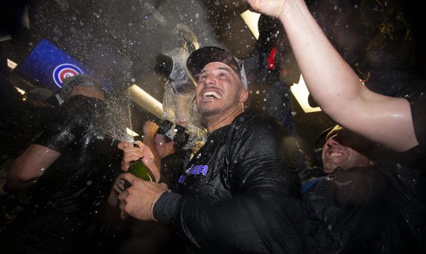 Nolan Arenado #28 of the Colorado Rockies celebrates in the clubhouse after defeating the Chicago C...