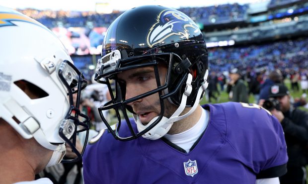 Philip Rivers #17 of the Los Angeles Chargers talks with Joe Flacco #5 of the Baltimore Ravens afte...
