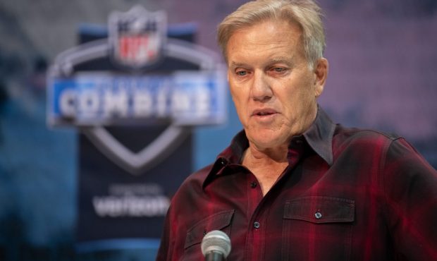 Denver Broncos general manager John Elway answers questions from the media during the NFL Scouting ...