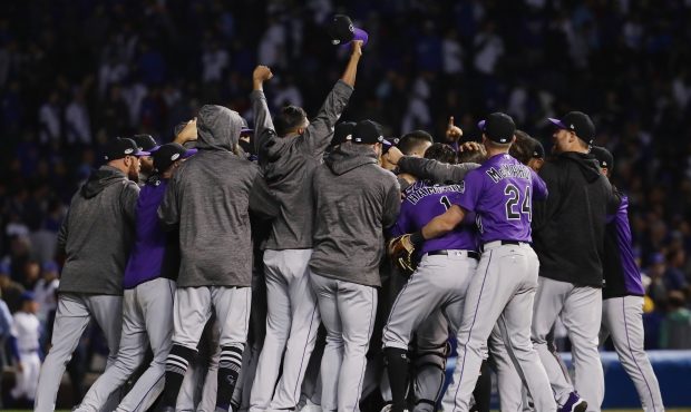The Colorado Rockies celebrate defeating the Chicago Cubs 2-1 in thirteen innings to win the Nation...