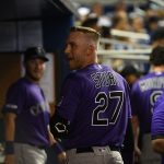MIAMI, FL - MARCH 28: Trevor Story #27 of the Colorado Rockies celebrates in the dugout after hitting a solo home run in the fifth inning against the Miami Marlins during Opening Day at Marlins Park on March 28, 2019 in Miami, Florida. (Photo by Mark Brown/Getty Images)