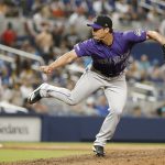 MIAMI, FL - MARCH 28: Seunghwan Oh #18 of the Colorado Rockies pitches during a game between the Colorado Rockies and the Miami Marlins at Marlins Park on Thursday, March 28, 2019 in Miami, Florida. (Photo by Rhona Wise/MLB Photos via Getty Images)