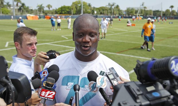 Ja'Wuan James #72 of the Miami Dolphins answers questions from the media after the rookie minicamp ...