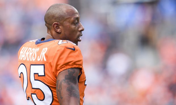 Chris Harris (25) of the Denver Broncos stands on the field after being taken out of the game follo...