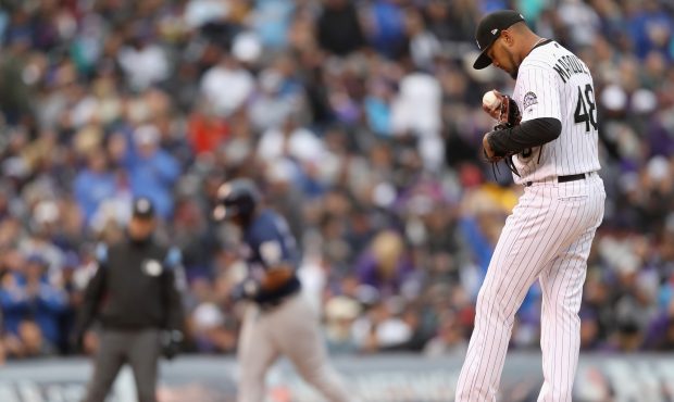 Starting pitcher German Marquez #48 of the Colorado Rockies reacts after giving up a solo homerun t...
