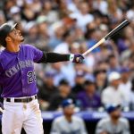 Nolan Arenado #28 of the Colorado Rockies watches the flight of a third inning sacrifice fly to bat in a run against the Los Angeles Dodgers during the Colorado Rockies home opener at Coors Field on April 5, 2019 in Denver, Colorado. (Photo by Dustin Bradford/Getty Images)