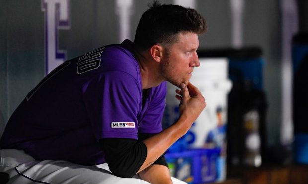 Colorado Rockies starting pitcher Kyle Freeland #21 looks out from the dugout between innings of a ...