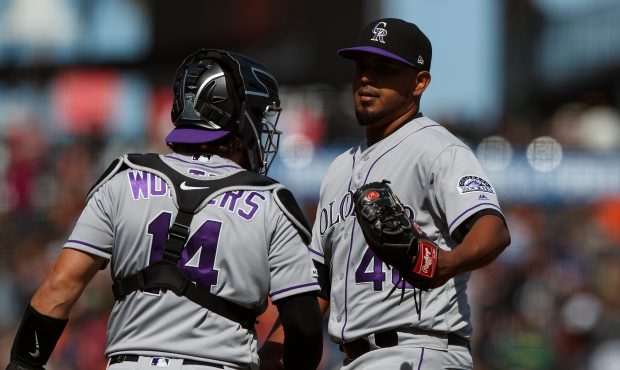German Marquez #48 of the Colorado Rockies is congratulated by Tony Wolters #14 after the game agai...