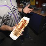 Zach Geiger spills ketchup on himself during the 2019 Opening Day for the Colorado Rockies on April 5, 2019 in Denver, Colorado. Colorado Rockies take on the Los Angeles Dodgers at Coors Field.(Photo by RJ Sangosti/MediaNews Group/The Denver Post via Getty Images)
