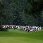Patrons watch as Tiger Woods of the United States plays a shot from the eighth tee during the final round of the Masters at Augusta National Golf Club on April 14, 2019 in Augusta, Georgia. (Photo by Kevin C. Cox/Getty Images)