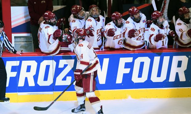 Denver Pioneers forward Jarid Lukosevicius (14) celebrates his goal with the bench in the second pe...