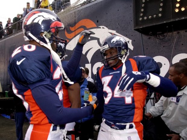 Denver Broncos Tyrone Braxton is wished the best by teamate Tory James,  before taking to the field for the last time at Mile High Stadium as a  Denver Bronco. Braxton will retire