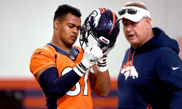 Denver Broncos tight end Noah Fant (87) runs with the football