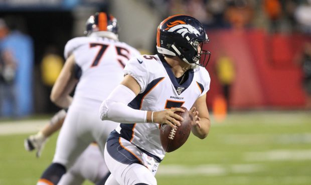 CANTON, OH - AUGUST 1:  Denver Broncos quarterback Drew Lock (3) rolls outs looking for a receiver ...