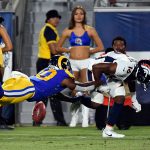 Wide receiver Johnathan Lloyd #10 of the Los Angeles Rams strips the ball from the hands of wide receiver Kelvin McKnight #16 of the Denver Broncos as he returns a kick during the second half of their pre season football game at Los Angeles Memorial Coliseum on August 24, 2019 in Los Angeles, California. (Photo by Kevork Djansezian/Getty Images)