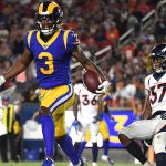Jalen Greene #3 of the Los Angeles Rams celebrates his touchdown in front of Linden Stephens #37 of the Denver Broncos, to take a 10-6 lead, during second half of a preseason game at Los Angeles Memorial Coliseum on August 24, 2019 in Los Angeles, California. (Photo by Harry How/Getty Images)