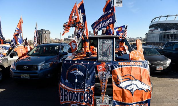 Broncos fans display their gear in the parking lot before the start of the game. The Denver Broncos...
