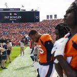 DENVER, CO - SEPTEMBER 15: Denver Broncos players bow their head in a moment of silence for former team owner Pat Bowlen prior to taking on the Chicago Bears at Empower Field at Mile High on September 15, 2019 in Denver, Colorado. (Photo by Timothy Nwachukwu/Getty Images)