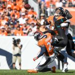 DENVER, CO - SEPTEMBER 29:  Joe Flacco #5 of the Denver Broncos is hit by D.J. Hayden #25 of the Jacksonville Jaguars as he attempts a first quarter pass at Empower Field at Mile High on September 29, 2019 in Denver, Colorado. (Photo by Dustin Bradford/Getty Images)