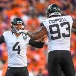 DENVER, CO - SEPTEMBER 29:  Josh Lambo #4 celebrates with Calais Campbell #93 of the Jacksonville Jaguars after a successful fourth quarter field goal against the Denver Broncos at Empower Field at Mile High on September 29, 2019 in Denver, Colorado. (Photo by Dustin Bradford/Getty Images)