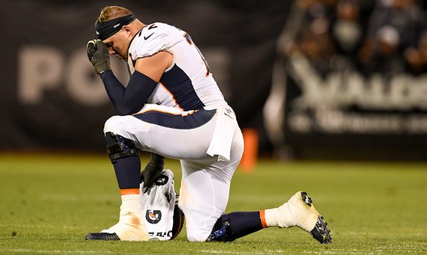 Garett Bolles (72) of the Denver Broncos rests during an injury timeout against the Oakland Raiders...
