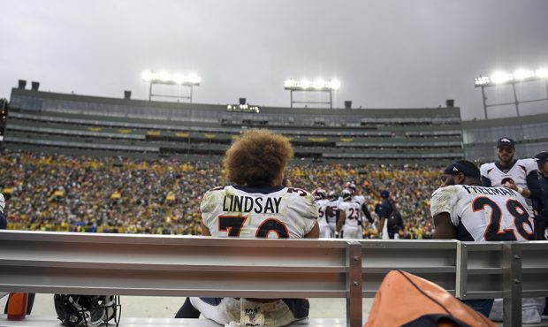 GREEN BAY, WI - SEPTEMBER 22: Phillip Lindsay (30) of the Denver Broncos sits on the bench after sc...