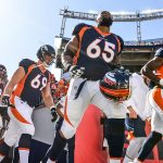 DENVER, CO - OCTOBER 13:  Denver Broncos players including Ronald Leary #65 run onto the field to warm up before a game against the Tennessee Titans at Empower Field at Mile High on October 13, 2019 in Denver, Colorado. (Photo by Dustin Bradford/Getty Images)