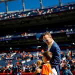 DENVER, CO - OCTOBER 13:  Former Denver Broncos quarterback Peyton Manning talks with his son Marshall Manning on the field before a game against the Tennessee Titans at Empower Field at Mile High on October 13, 2019 in Denver, Colorado. (Photo by Justin Edmonds/Getty Images)