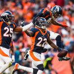 DENVER, CO - OCTOBER 13:  Kareem Jackson #22 of the Denver Broncos celebrates with teammates Chris Harris #25 and Justin Simmons #31 after an interception in the fourth quarter  against the Tennessee Titans at Empower Field at Mile High on October 13, 2019 in Denver, Colorado. (Photo by Dustin Bradford/Getty Images)