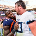 DENVER, CO - OCTOBER 13:  Kareem Jackson #22 of the Denver Broncos and Ben Jones #60 of the Tennessee Titans have a word on the field after the Denver Broncos 16-0 win at Empower Field at Mile High on October 13, 2019 in Denver, Colorado. (Photo by Dustin Bradford/Getty Images)