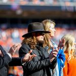 DENVER, CO - OCTOBER 13:  The family of the late owner of the Denver Broncos Pat Bowlen, including (L) Patrick Bowlen Jr. and (2L) John Bowlen stand on the field during a ceremony to present the Hall of Fame ring to the Bowlen family during halftime of a game against the Tennessee Titans at Empower Field at Mile High on October 13, 2019 in Denver, Colorado. (Photo by Justin Edmonds/Getty Images)