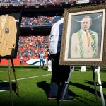 DENVER, CO - OCTOBER 13:  A portrait of the late owner of the Denver Broncos Pat Bowlen is displayed next to the gold jacket enshrining him into the Pro Football Hall of Fame during a halftime ceremony against the Tennessee Titans at Empower Field at Mile High on October 13, 2019 in Denver, Colorado. (Photo by Justin Edmonds/Getty Images)