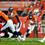 DENVER, CO - OCTOBER 17:  Running back Phillip Lindsay #30 of the Denver Broncos runs through a hole in the Kansas City Chiefs defense during the first quarter at Empower Field at Mile High on October 17, 2019 in Denver, Colorado. (Photo by Justin Edmonds/Getty Images)
