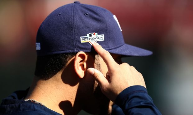 Tommy Pham #29 of the Tampa Bay Rays points to the Post Season logo on his hat before their game ag...