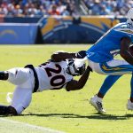 Keenan Allen #13 of the Los Angeles Chargers breaks a tackle by Duke Dawson #20 of the Denver Broncos during the first half of a game at Dignity Health Sports Park on October 06, 2019 in Carson, California. (Photo by Sean M. Haffey/Getty Images)