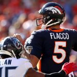 DENVER, COLORADO - OCTOBER 13: Quarterback Joe Flacco #5 of the Denver Broncos throws under pressure by Logan Ryan #26 of the Tennessee Titans in the second quarter at Broncos Stadium at Mile High on October 13, 2019 in Denver, Colorado. (Photo by Matthew Stockman/Getty Images)