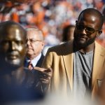 DENVER, CO - OCTOBER 13: Former Denver Broncos cornerback Champ Bailey points to his bust during the ring of fame induction halftime presentation on Sunday, October 13, 2019 at Empower Field at Mile High. The Denver Broncos hosted the Tennessee Titans for the game. (Photo by Eric Lutzens/The Denver Post)