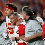 DENVER, COLORADO - OCTOBER 17: Quarterback Patrick Mahomes #15 of the Kansas City Chiefs is escorted offs the field after an injury on the first half against the Denver Broncos in the game at Broncos Stadium at Mile High on October 17, 2019 in Denver, Colorado. (Photo by Matthew Stockman/Getty Images)