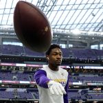 MINNEAPOLIS, MINNESOTA - NOVEMBER 17:  Stefon Diggs #14 of the Minnesota Vikings throws a football with fans before a game against the Denver Broncos at U.S. Bank Stadium on November 17, 2019 in Minneapolis, Minnesota. (Photo by Adam Bettcher/Getty Images)