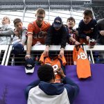 MINNEAPOLIS, MINNESOTA - NOVEMBER 17:  Courtland Sutton #14 of the Denver Broncos signs autographs for NFL fans before a game against the Minnesota Vikings at U.S. Bank Stadium on November 17, 2019 in Minneapolis, Minnesota. (Photo by Hannah Foslien/Getty Images)